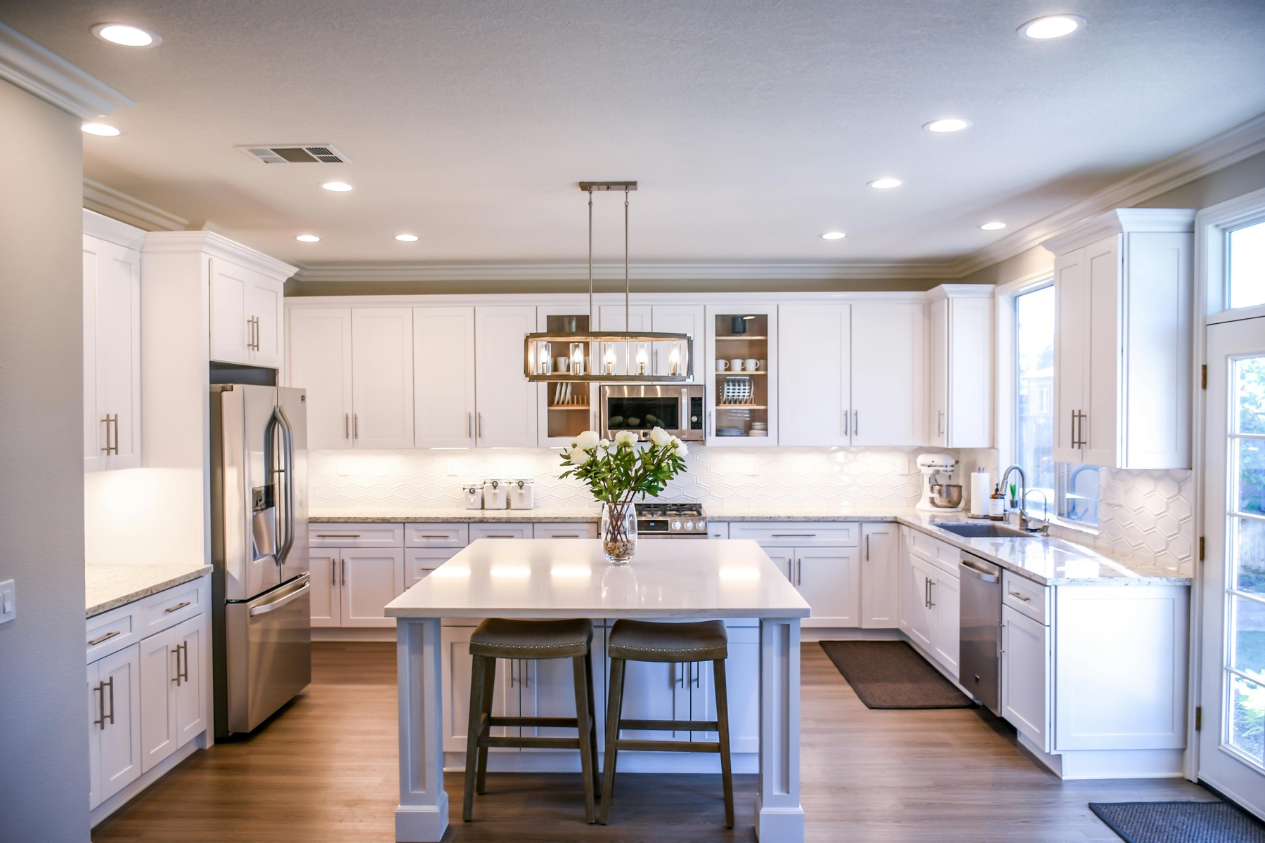 Finished custom cabinetry with detailed crown moulding and trim